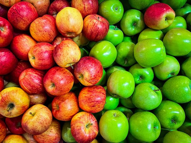 A variety of green and red apples